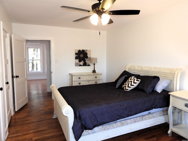 bedroom featuring ceiling fan and dark hardwood / wood-style flooring