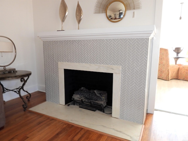 details featuring a fireplace and hardwood / wood-style flooring