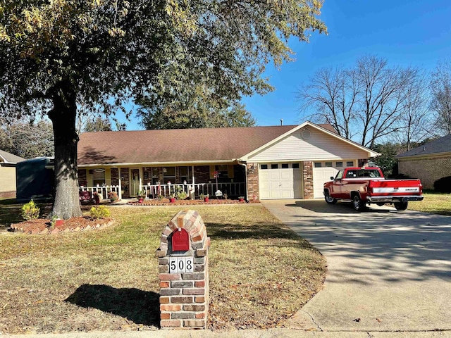 ranch-style house with a front yard, a porch, and a garage