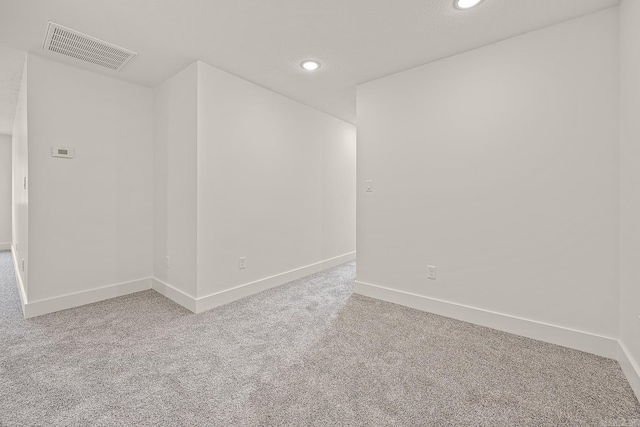 spare room featuring carpet flooring