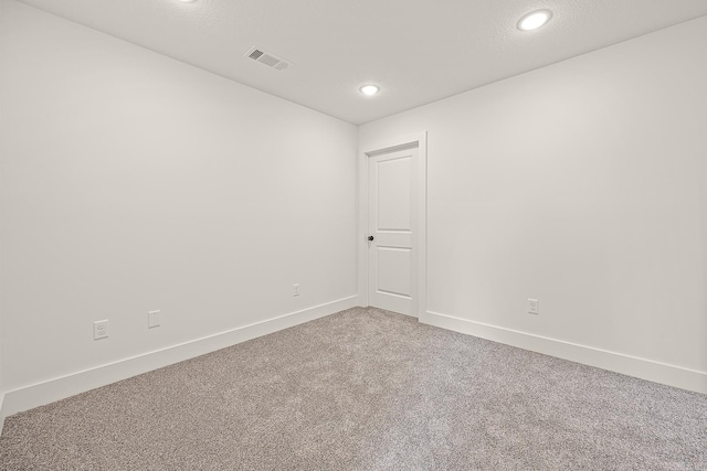 unfurnished room featuring carpet flooring