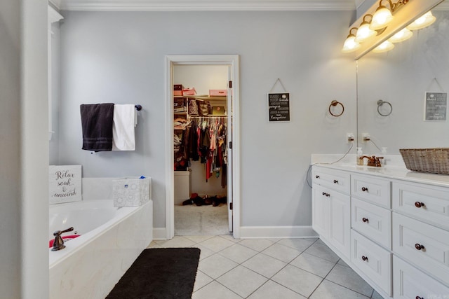 bathroom with tile patterned floors, tiled tub, vanity, and ornamental molding