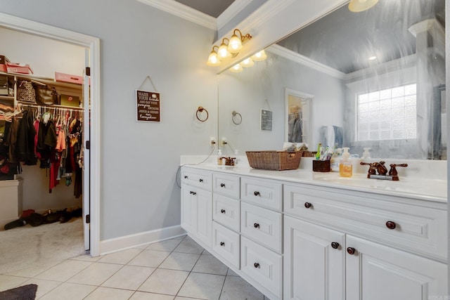 bathroom with tile patterned flooring, vanity, and crown molding