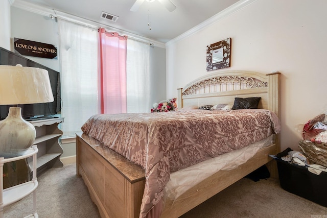 bedroom with carpet flooring, ceiling fan, and ornamental molding