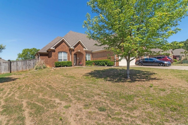 view of front facade featuring a front lawn and a garage