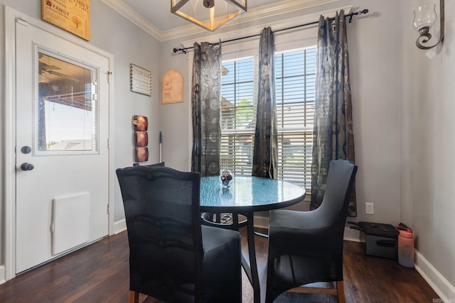 dining area featuring ornamental molding and dark wood-type flooring