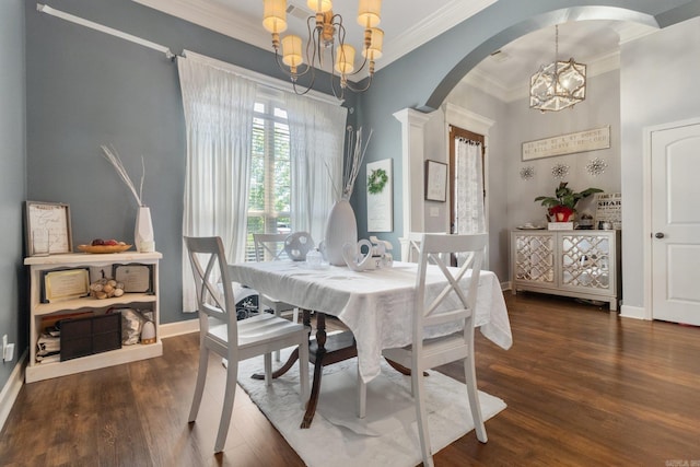 dining room with a notable chandelier, dark hardwood / wood-style floors, and crown molding