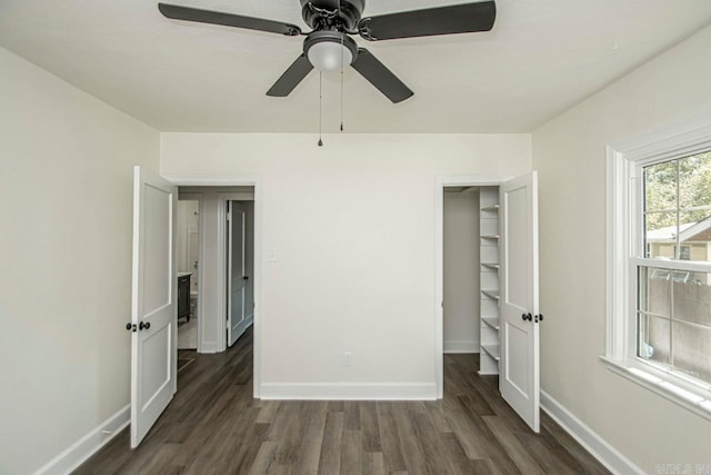 unfurnished bedroom with a closet, dark hardwood / wood-style floors, and ceiling fan