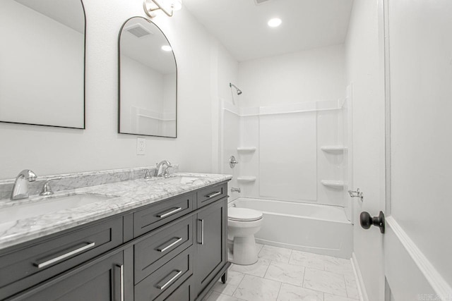 full bathroom featuring bathing tub / shower combination, vanity, and toilet