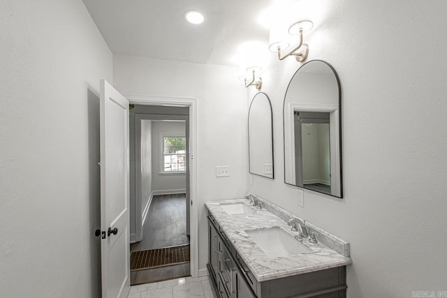 bathroom with vanity and hardwood / wood-style flooring