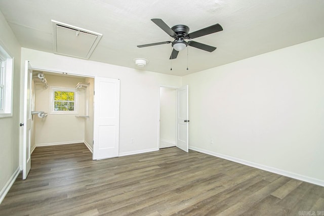 unfurnished bedroom featuring ceiling fan, dark hardwood / wood-style flooring, and a closet