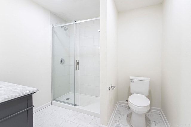 bathroom with vanity, toilet, and walk in shower