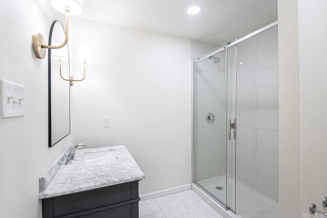 bathroom with vanity and an enclosed shower