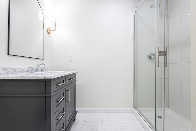 bathroom featuring vanity and a shower with shower door