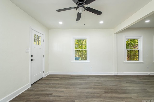 foyer entrance with dark hardwood / wood-style floors and ceiling fan