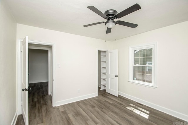 unfurnished bedroom featuring a closet, ceiling fan, and hardwood / wood-style floors