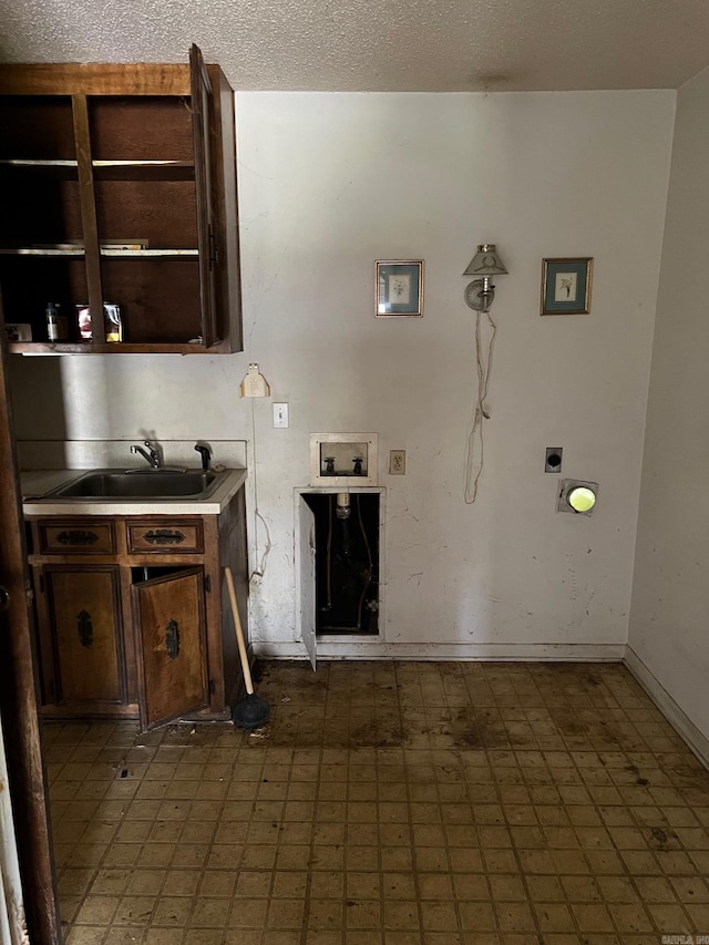 kitchen with dark brown cabinets and sink