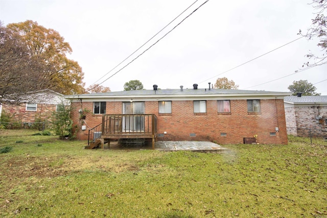 back of house with a lawn and a patio