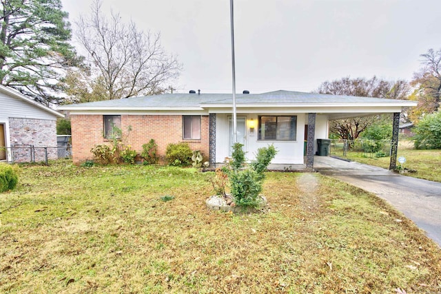 ranch-style home with a front lawn and a carport