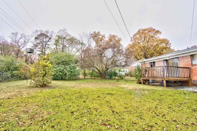 view of yard with a wooden deck