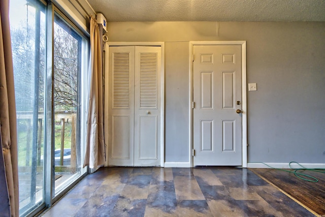 interior space with a textured ceiling