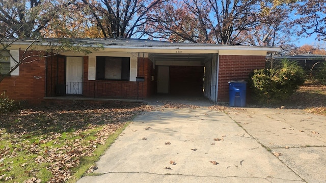 view of front of house featuring covered porch and a carport