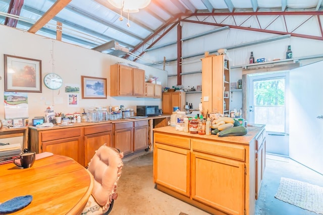 kitchen with vaulted ceiling with beams