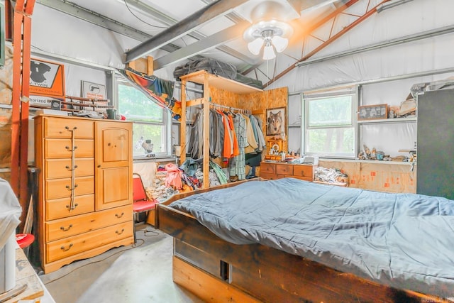 bedroom featuring ceiling fan, lofted ceiling, and a closet