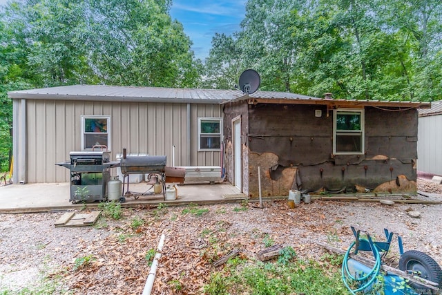 back of property featuring a patio area