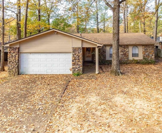 ranch-style house featuring a garage