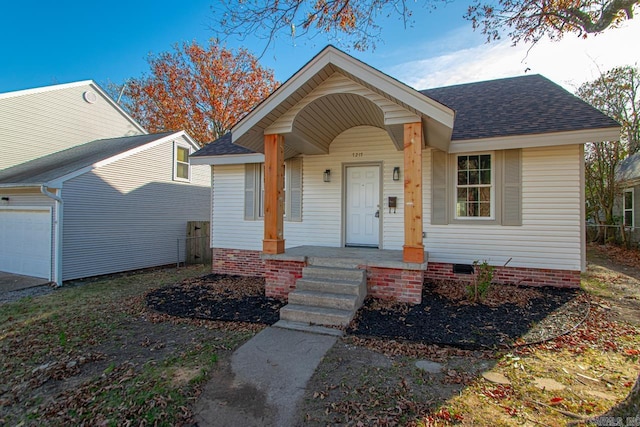 view of front of house featuring a garage and covered porch