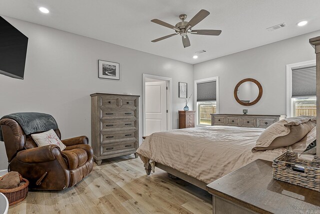 bedroom with ceiling fan and light hardwood / wood-style floors