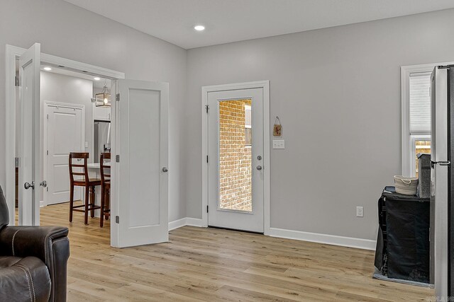 entrance foyer with light hardwood / wood-style flooring