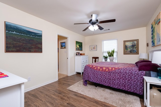 bedroom with hardwood / wood-style floors and ceiling fan