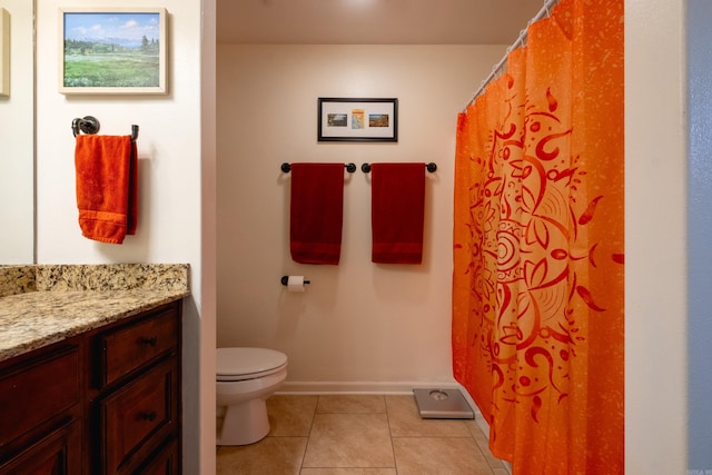 bathroom featuring toilet, vanity, and tile patterned floors