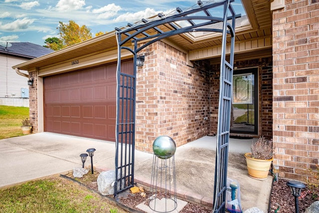 entrance to property featuring a garage