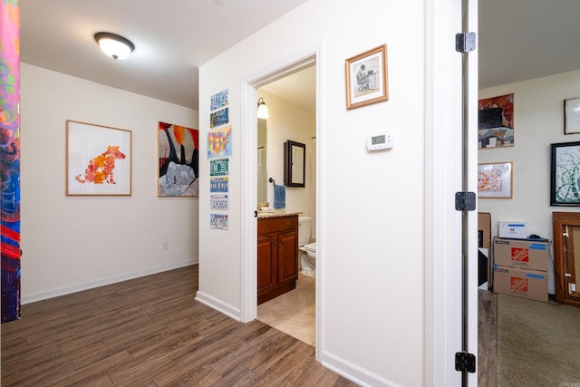 corridor featuring dark hardwood / wood-style flooring