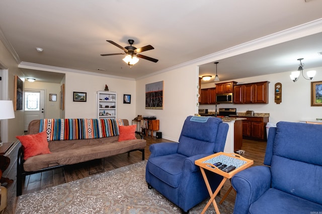 living room featuring ceiling fan with notable chandelier, dark hardwood / wood-style flooring, and crown molding