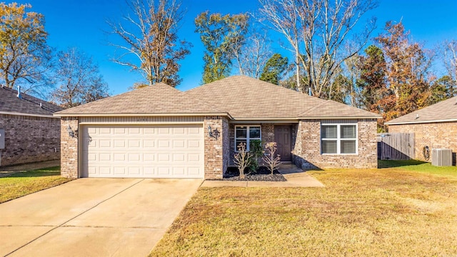 single story home with central AC, a garage, and a front lawn