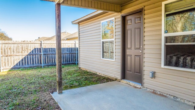 property entrance featuring a patio