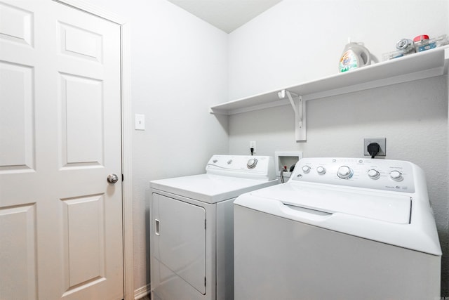 washroom with separate washer and dryer