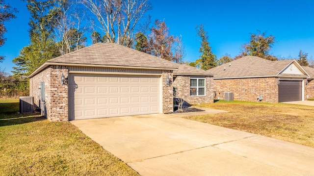 ranch-style house with a front yard, a garage, and central air condition unit