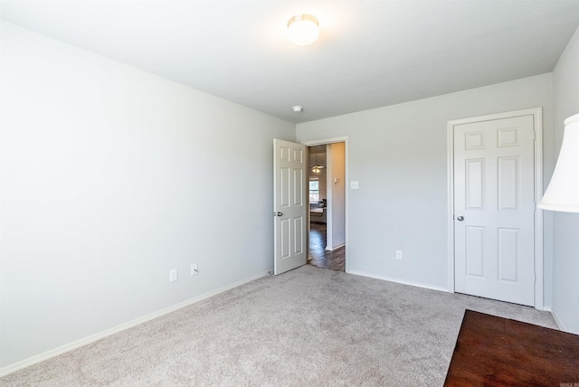 unfurnished bedroom featuring light colored carpet