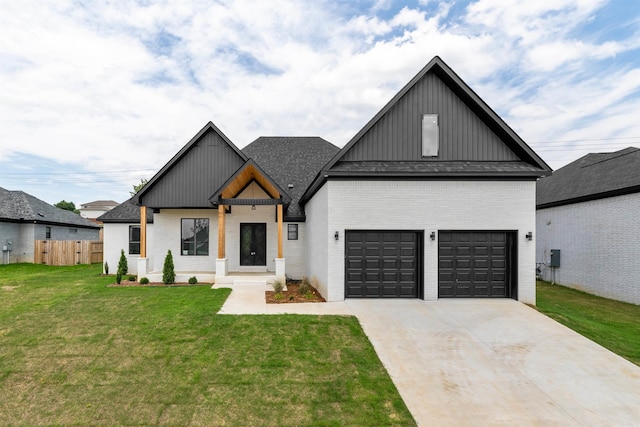 modern inspired farmhouse with a front lawn