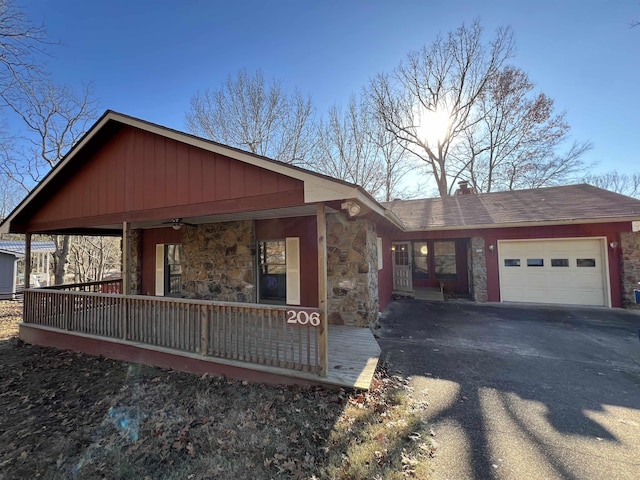 view of front of property with covered porch and a garage