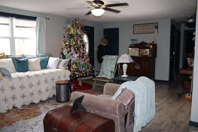 living room with ceiling fan and hardwood / wood-style floors