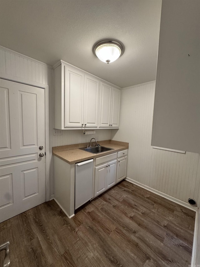 interior space with white cabinetry, sink, dark wood-type flooring, stainless steel dishwasher, and a textured ceiling