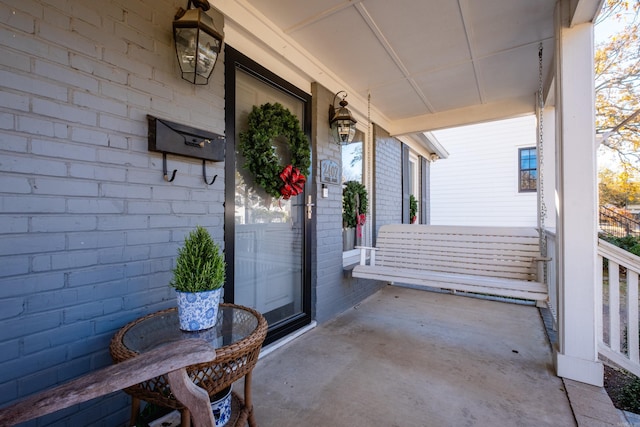 doorway to property with a porch