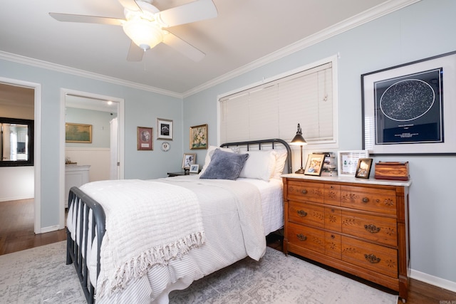 bedroom featuring ensuite bath, ceiling fan, crown molding, and light hardwood / wood-style floors