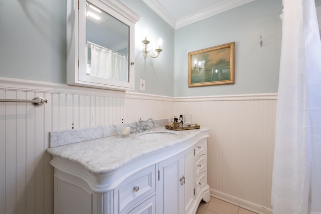 bathroom featuring tile patterned flooring, vanity, and ornamental molding